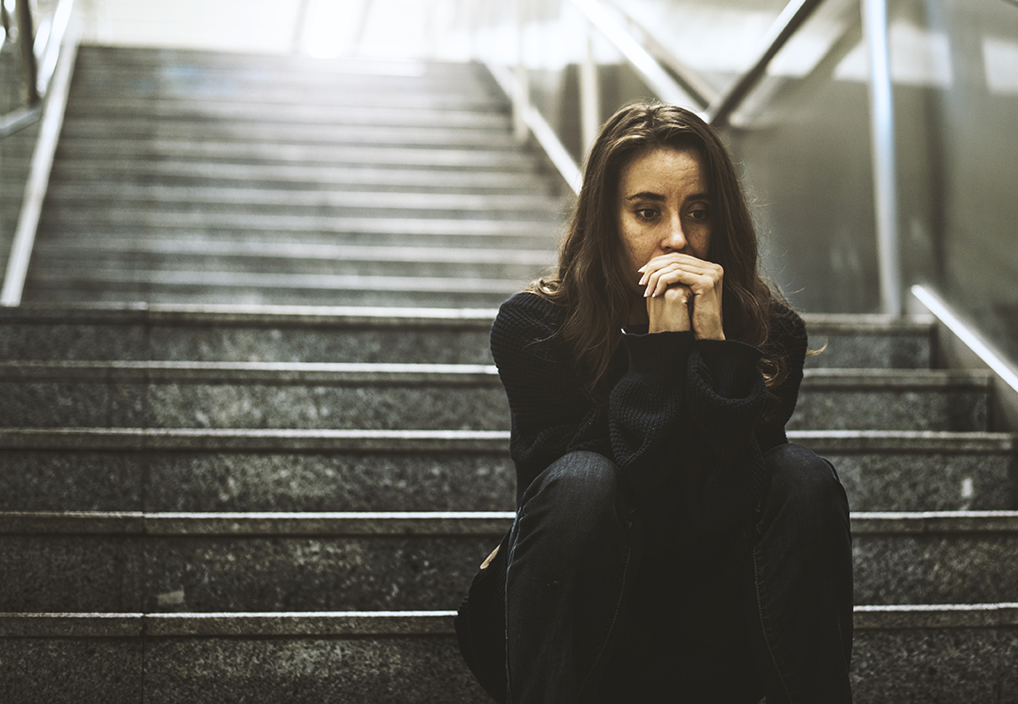 Woman Sitting Look Worried on The Stairway