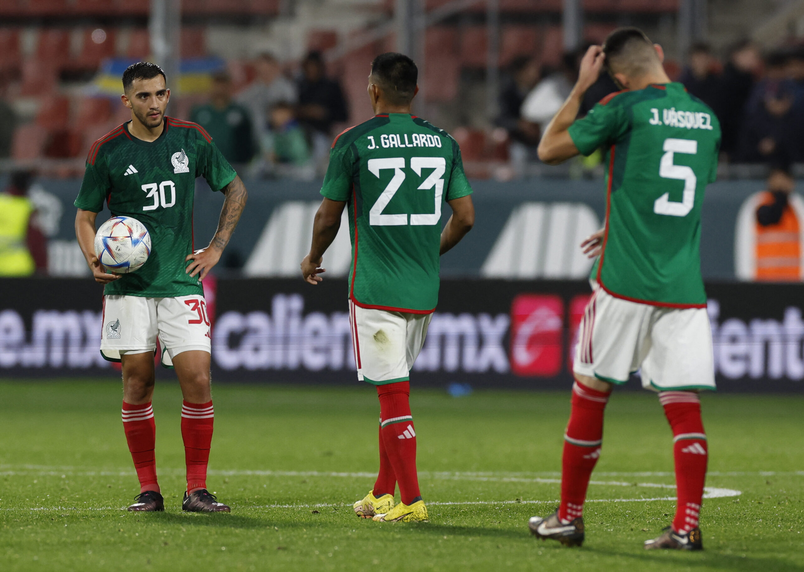 Soccer Football - International Friendly - Mexico v Sweden - Estadi Montilivi, Girona, Spain - November 16, 2022 Mexico's Luis Chavez, Jesus Gallardo and Johan Vasquez look dejected after the match REUTERS/Albert Gea